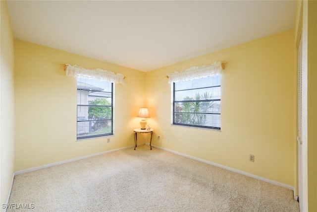 113 Picardy Ct, Naples, FL 34112 - spare room featuring carpet flooring and baseboards