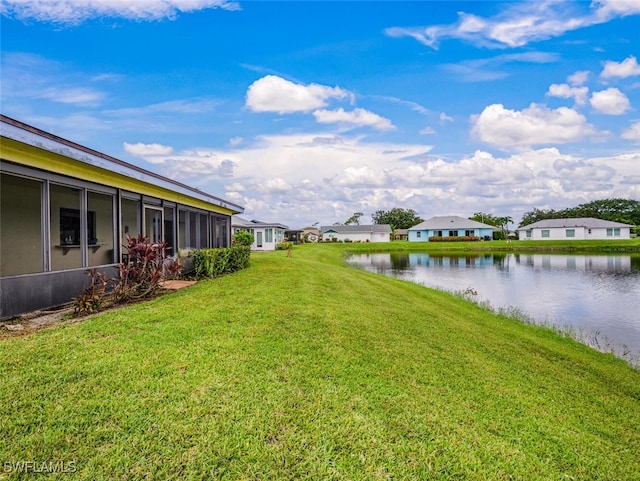 113 Picardy Ct, Naples, FL 34112 - view of grassy yard featuring a water view, a residential view, and a sunroom