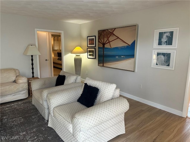 120 Bay Mar Dr, Fort Myers Beach, FL 33931 - living area featuring wood finished floors and baseboards