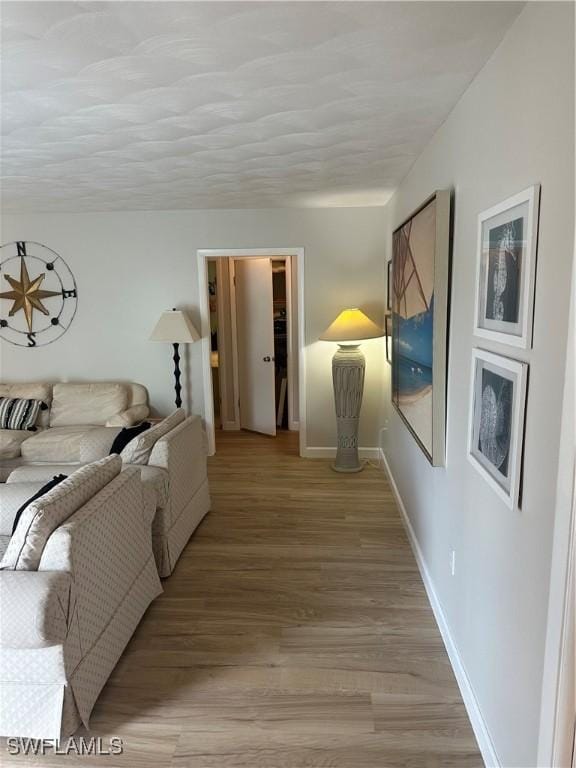 120 Bay Mar Dr, Fort Myers Beach, FL 33931 - living room featuring light wood finished floors and baseboards