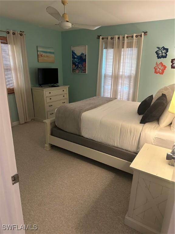 120 Bay Mar Dr, Fort Myers Beach, FL 33931 - bedroom with carpet floors and ceiling fan