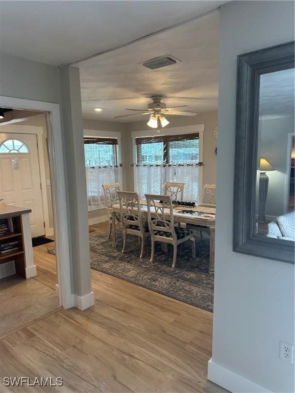 120 Bay Mar Dr, Fort Myers Beach, FL 33931 - dining space featuring ceiling fan and light wood-type flooring