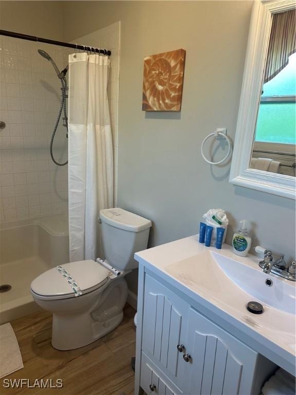 120 Bay Mar Dr, Fort Myers Beach, FL 33931 - full bath featuring a stall shower, vanity, and wood finished floors