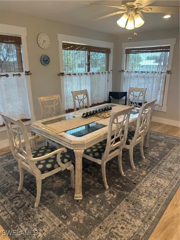 120 Bay Mar Dr, Fort Myers Beach, FL 33931 - dining area with light wood-type flooring and a ceiling fan