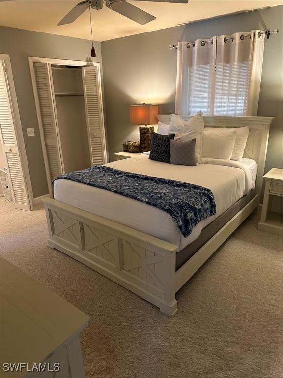 120 Bay Mar Dr, Fort Myers Beach, FL 33931 - bedroom with light colored carpet, a closet, and a ceiling fan