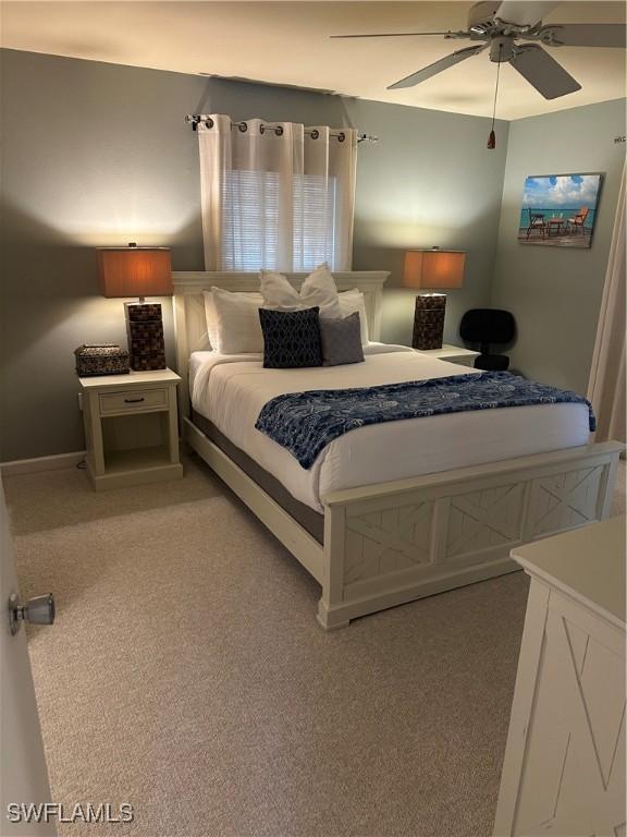 120 Bay Mar Dr, Fort Myers Beach, FL 33931 - bedroom featuring light carpet and ceiling fan