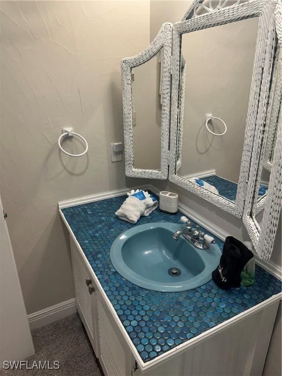 120 Bay Mar Dr, Fort Myers Beach, FL 33931 - bathroom featuring vanity and baseboards
