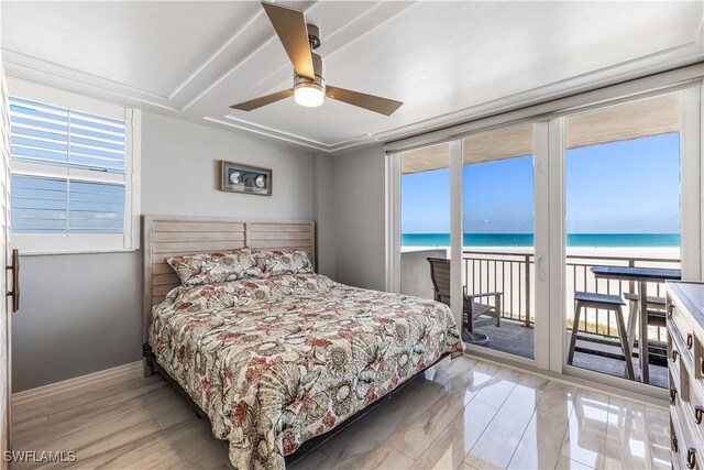 180 Seaview Ct Unit 507, Marco Island, FL 34145 - bedroom with access to exterior, a water view, and a ceiling fan
