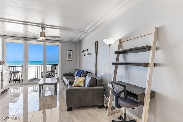 180 Seaview Ct Unit 507, Marco Island, FL 34145 - living room featuring a water view and a ceiling fan