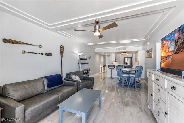 180 Seaview Ct Unit 507, Marco Island, FL 34145 - living area with ceiling fan and a raised ceiling