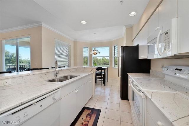 8610 Cedar Hammock Cir Unit 1223, Naples, FL 34112 - kitchen with white appliances, crown molding, light tile patterned floors, white cabinets, and hanging light fixtures