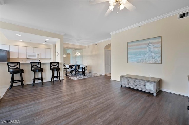 8610 Cedar Hammock Cir Unit 1223, Naples, FL 34112 - living room with arched walkways, dark wood-style flooring, a ceiling fan, ornamental molding, and recessed lighting