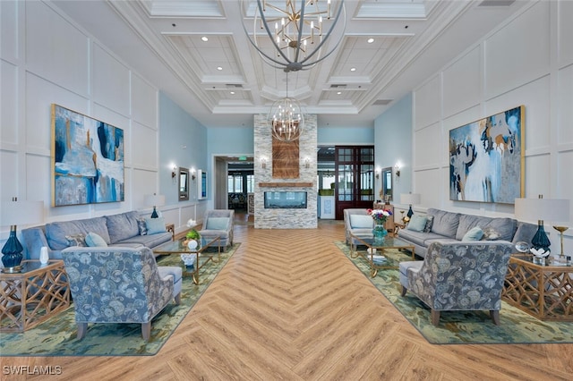 8610 Cedar Hammock Cir Unit 1223, Naples, FL 34112 - living room with a chandelier, a high ceiling, coffered ceiling, beam ceiling, and a stone fireplace
