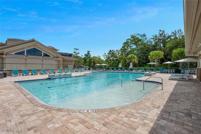 8610 Cedar Hammock Cir Unit 1223, Naples, FL 34112 - community pool with a patio