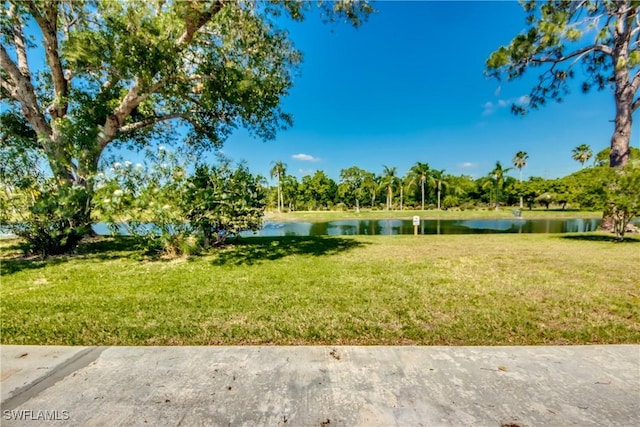 17225 Castleview Dr, North Fort Myers, FL 33917 - view of grassy yard with a water view