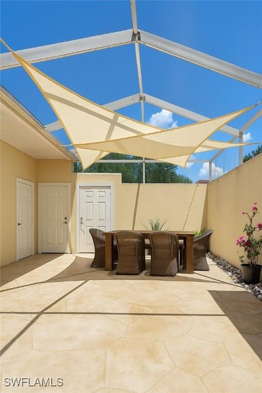 4211 Covey Cir Unit 22C, Naples, FL 34109 - view of patio / terrace featuring outdoor dining space