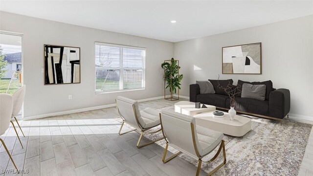 841 Foxtail St E, Lehigh Acres, FL 33974 - living room with light wood-style flooring and recessed lighting