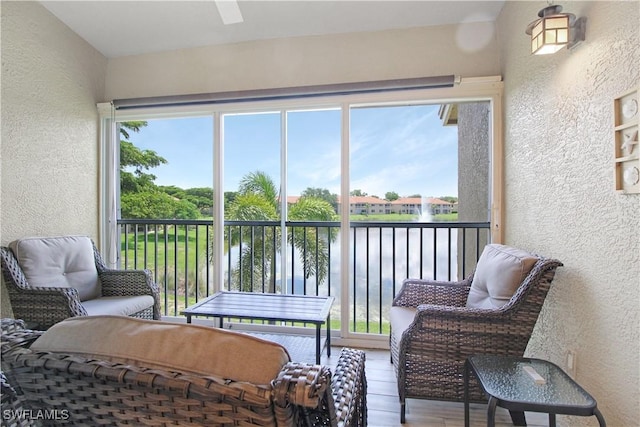 6770 Huntington Lakes Cir Unit 203, Naples, FL 34119 - sunroom / solarium with a water view and ceiling fan