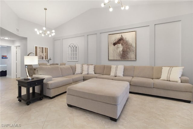 6770 Huntington Lakes Cir Unit 203, Naples, FL 34119 - living room featuring a chandelier, lofted ceiling, and light tile patterned flooring