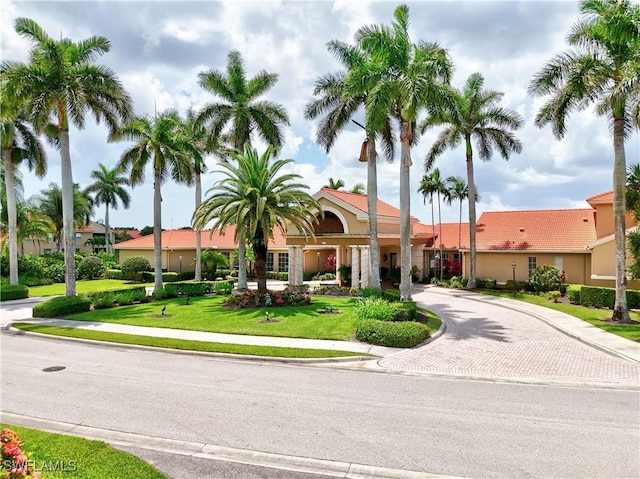 6770 Huntington Lakes Cir Unit 203, Naples, FL 34119 - view of building exterior featuring decorative driveway