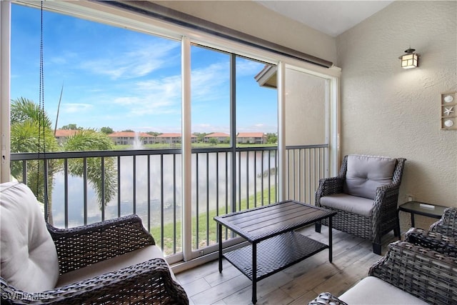 6770 Huntington Lakes Cir Unit 203, Naples, FL 34119 - sunroom with a water view and healthy amount of natural light