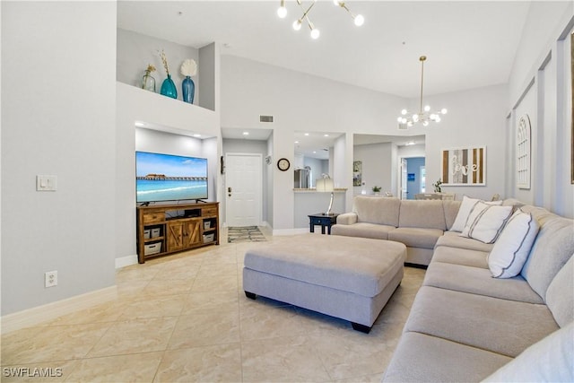 6770 Huntington Lakes Cir Unit 203, Naples, FL 34119 - living area featuring a chandelier, lofted ceiling, and light tile patterned floors