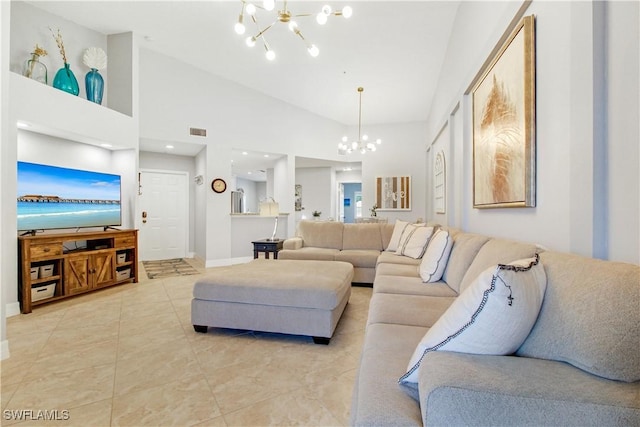 6770 Huntington Lakes Cir Unit 203, Naples, FL 34119 - living area with a chandelier, lofted ceiling, and light tile patterned floors