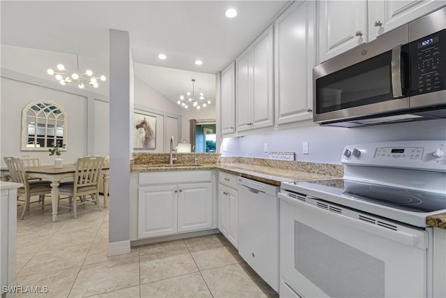 6770 Huntington Lakes Cir Unit 203, Naples, FL 34119 - kitchen featuring white appliances, a chandelier, white cabinetry, light tile patterned flooring, and recessed lighting