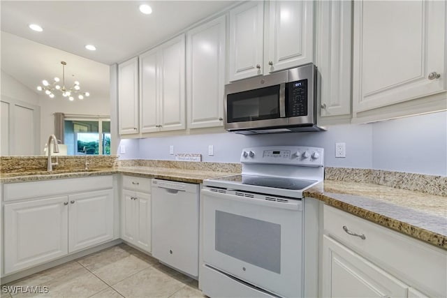 6770 Huntington Lakes Cir Unit 203, Naples, FL 34119 - kitchen featuring white appliances, white cabinets, a chandelier, recessed lighting, and light tile patterned floors