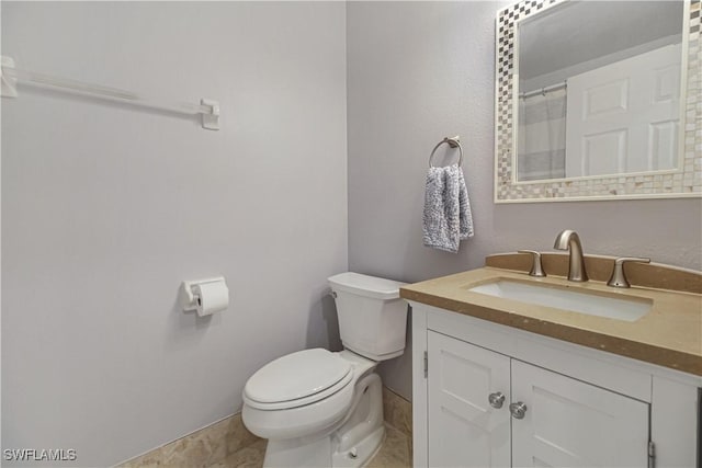 6770 Huntington Lakes Cir Unit 203, Naples, FL 34119 - bathroom with vanity and toilet