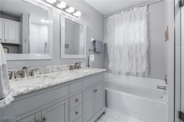6770 Huntington Lakes Cir Unit 203, Naples, FL 34119 - bathroom with a bath, double vanity, tile patterned flooring, and a shower