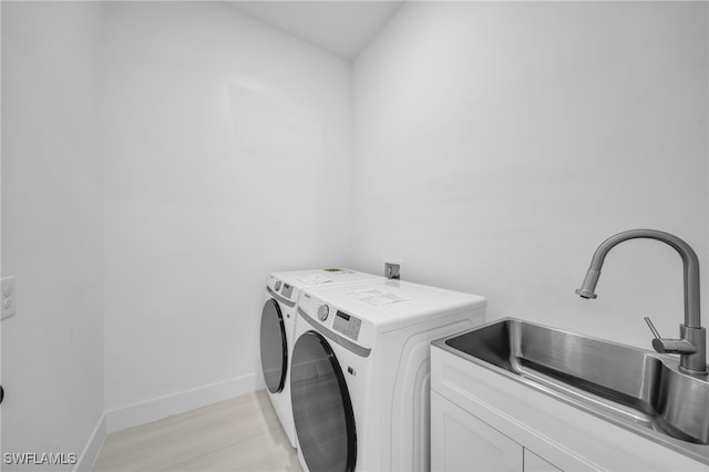 542 Raintree St E, Lehigh Acres, FL 33974 - laundry room with cabinet space and washer and dryer