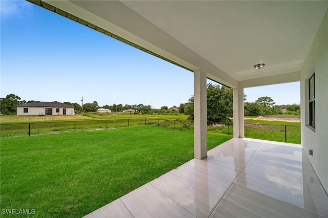 542 Raintree St E, Lehigh Acres, FL 33974 - fenced backyard featuring a patio area