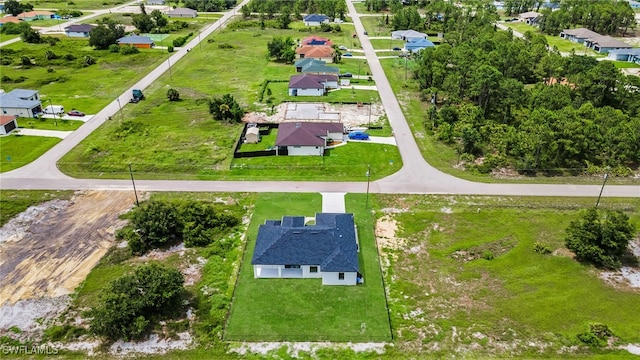542 Raintree St E, Lehigh Acres, FL 33974 - aerial perspective of suburban area