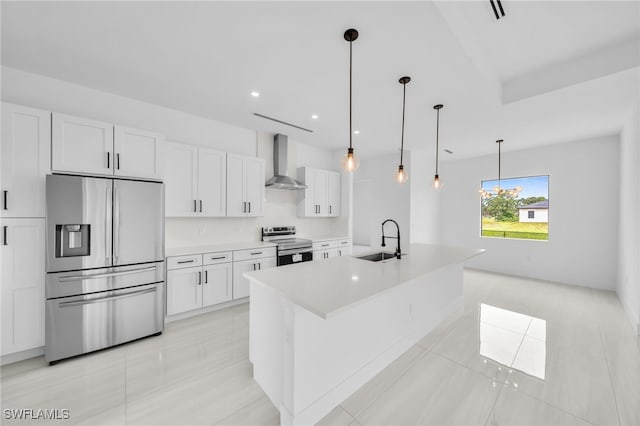 542 Raintree St E, Lehigh Acres, FL 33974 - kitchen with stainless steel appliances, wall chimney exhaust hood, white cabinets, light tile patterned floors, and recessed lighting
