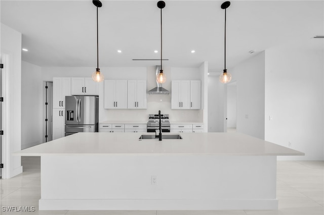 542 Raintree St E, Lehigh Acres, FL 33974 - kitchen with stainless steel appliances, white cabinetry, a large island with sink, light countertops, and recessed lighting