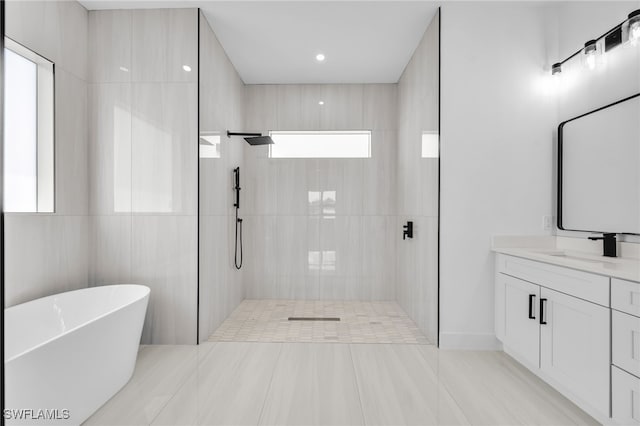 542 Raintree St E, Lehigh Acres, FL 33974 - bathroom with a freestanding bath, vanity, and a shower stall