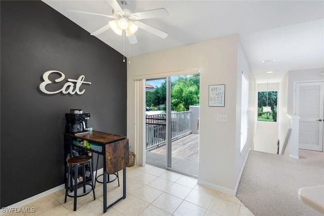 5040 Cedar Springs Dr Unit 201, Naples, FL 34110 - dining space featuring a ceiling fan and light tile patterned flooring