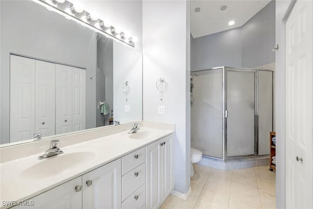 5040 Cedar Springs Dr Unit 201, Naples, FL 34110 - full bath with a closet, double vanity, a stall shower, and tile patterned flooring