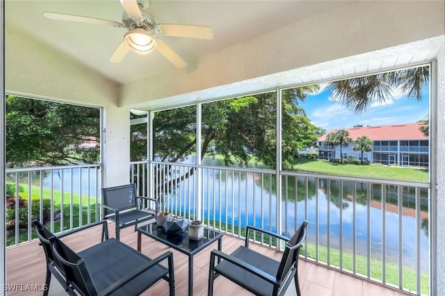 5040 Cedar Springs Dr Unit 201, Naples, FL 34110 - sunroom / solarium with a water view, a ceiling fan, lofted ceiling, and plenty of natural light
