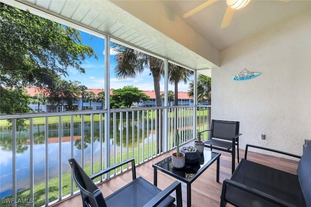 5040 Cedar Springs Dr Unit 201, Naples, FL 34110 - balcony featuring a water view, ceiling fan, and outdoor lounge area