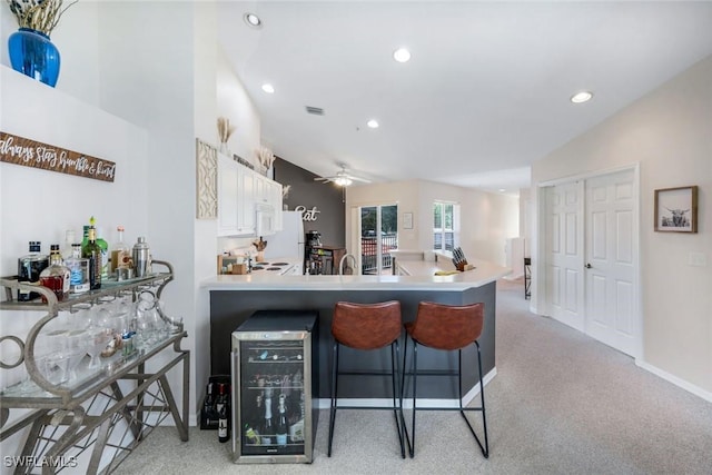 5040 Cedar Springs Dr Unit 201, Naples, FL 34110 - kitchen featuring white appliances, light carpet, recessed lighting, ceiling fan, and white cabinetry