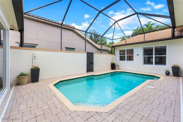 4333 Mistlethrush Ln, Naples, FL 34119 - outdoor pool with a patio and glass enclosure