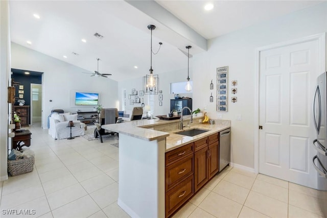 4333 Mistlethrush Ln, Naples, FL 34119 - kitchen with brown cabinetry, open floor plan, light tile patterned floors, light stone countertops, and dishwasher