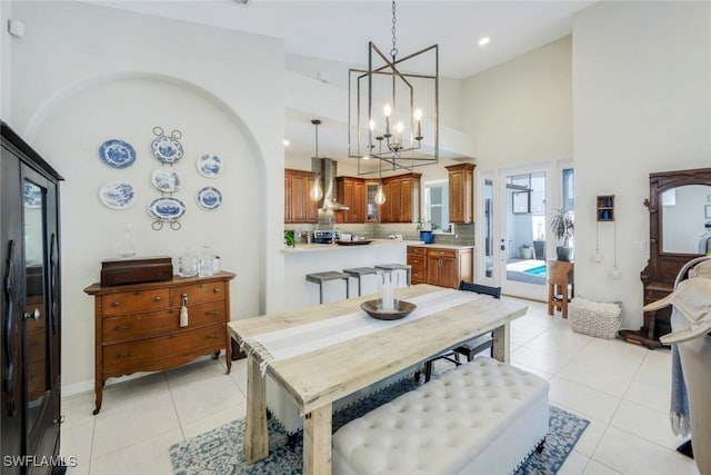 4333 Mistlethrush Ln, Naples, FL 34119 - dining area with a chandelier, light tile patterned flooring, high vaulted ceiling, and recessed lighting