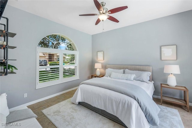 4333 Mistlethrush Ln, Naples, FL 34119 - tiled bedroom featuring baseboards and a ceiling fan