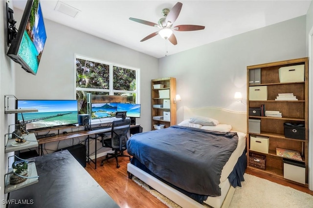 4333 Mistlethrush Ln, Naples, FL 34119 - bedroom featuring wood finished floors and ceiling fan