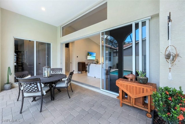4333 Mistlethrush Ln, Naples, FL 34119 - sunroom with outdoor dining area