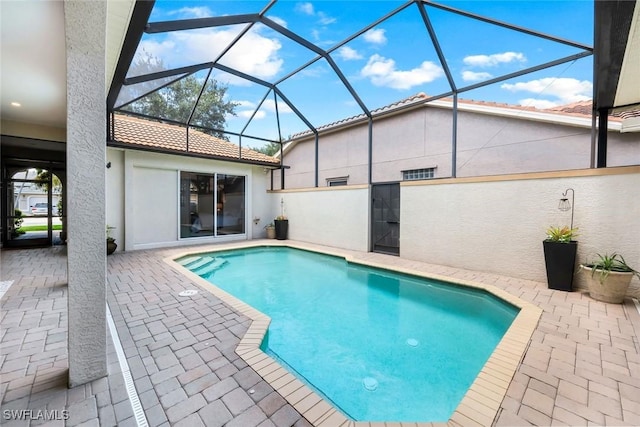 4333 Mistlethrush Ln, Naples, FL 34119 - outdoor pool with a patio area and glass enclosure