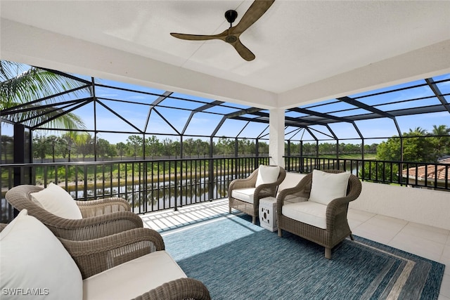 4406 Caldera Cir, Naples, FL 34119 - view of patio / terrace with a water view, a ceiling fan, and glass enclosure
